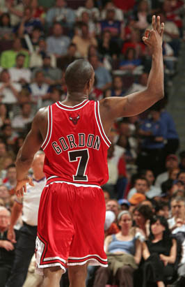Chicago Bulls' Tyrus Thomas, top, dunks over his teammate Ben