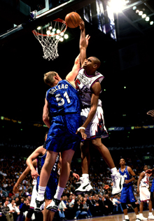 New Jersey Nets forward Vince Carter slams home a dunk against the
