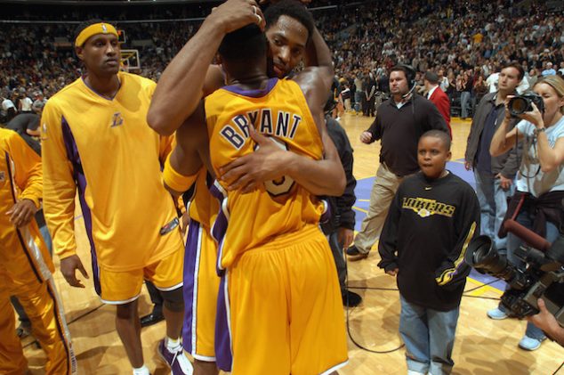 LOS ANGELES - DECEMBER 6: Robert Horry #5 of the Los Angeles Lakers embraces Kobe Bryant #8 as Samaki Walker #52 look on as they celebrate the 30-point comeback win against the Dallas Mavericks after the NBA game at Staples Center on December 6, 2002 in Los Angeles, California. The Lakers won 105-103. NOTE TO USER: User expressly acknowledges and agrees that, by downloading and/or using this Photograph, User is consenting to the terms and conditions of the Getty Images License Agreement Mandatory Copyright Notice: Copyright 2002 NBAE (Photo by Andrew D. Bernstein/NBAE/Getty Images)