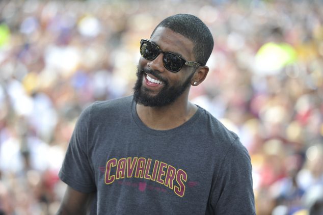 CLEVELAND, OH - JUNE 22: Kyrie Irving #2 of the Cleveland Cavaliers speaks to the fans during the Cleveland Cavaliers Victory Parade And Rally on June 22, 2016 in downtown Cleveland, Ohio. NOTE TO USER: User expressly acknowledges and agrees that, by downloading and/or using this Photograph, user is consenting to the terms and conditions of the Getty Images License Agreement. Mandatory Copyright Notice: Copyright 2016 NBAE (Photo by David Liam Kyle/NBAE/Getty Images)