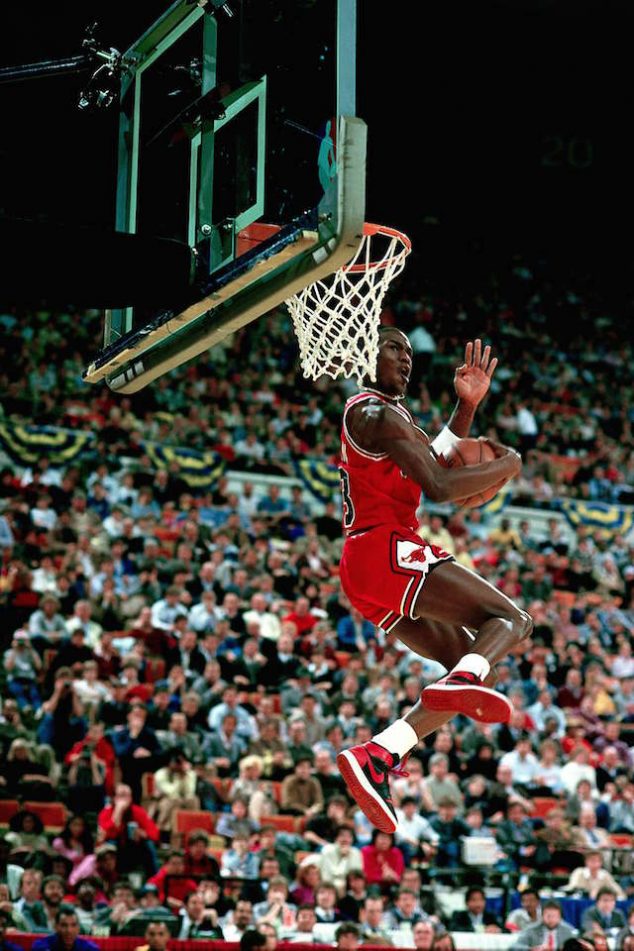 INDIANAPOLIS - FEBRUARY 10: Michael Jordan #23 of the Chicago Bulls goes for a dunk during the 1985 NBA All Star Slam Dunk Competition at the Hoosier Dome on February 10, 1985 in Indianapolis, Indiana. NOTE TO USER: User expressly acknowledges and agrees that, by downloading and/or using this Photograph, User is consenting to the terms and conditions of the Getty Images License Agreement. Mandatory copyright notice: Copyright NBAE 1985 (Photo by Andrew D. Bernstein/NBAE via Getty Images)