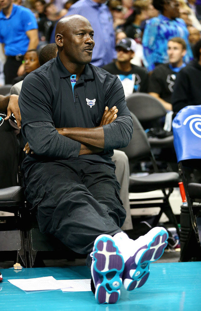 CHARLOTTE, NC - OCTOBER 29: Michael Jordan, owner of the Charlotte Hornets, watches on during their game against the Milwaukee Bucks at Time Warner Cable Arena on October 29, 2014 in Charlotte, North Carolina. The Charlotte Hornets defeated the Milwaukee Bucks 108-106 in overtime. NOTE TO USER: User expressly acknowledges and agrees that, by downloading and or using this photograph, User is consenting to the terms and conditions of the Getty Images License Agreement. (Photo by Streeter Lecka/Getty Images)