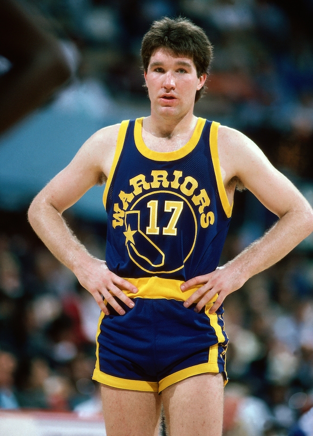 LOS ANGELES - 1985: Chris Mullin #17 of the Golden State Warriors waits for action to start against the Los Angeles Lakers during the NBA game at the Forum circa 1985 in Los Angeles, California. NOTE TO USER: User expressly acknowledges and agrees that, by downloading and/or using this Photograph, User is consenting to the terms and conditions of the Getty Images License Agreement. Mandatory Copyright Notice: Copyright 1985 NBAE (Photo by Andrew D. Bernstein/NBAE via Getty Images)