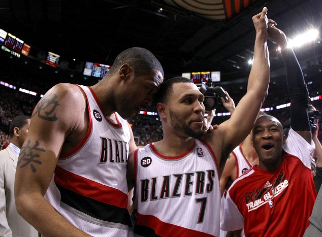 PORTLAND, OR - APRIL 23: Brandon Roy #7 of the Portland Trail Blazers celebrates with teammates Marcus Camby #23 and Armon Johnson #1 after overcoming a 23 point deficit to defeat the Dallas Mavericks 84-82 in Game Four of the Western Conference Quarterfinals in the 2011 NBA Playoffs on April 23, 2011 at the Rose Garden in Portland, Oregon. NOTE TO USER: User expressly acknowledges and agrees that, by downloading and or using this photograph, User is consenting to the terms and conditions of the Getty Images License Agreement. (Photo by Jonathan Ferrey/Getty Images)