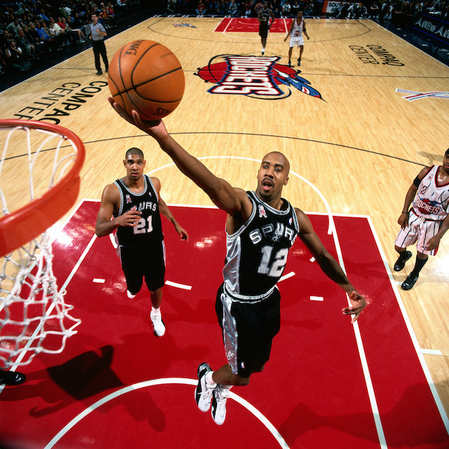 1 Dec 2001: Bruce Bowen #12 of the San Antonio Spurs goes for a layup against the Houston Rockets during the NBA Game at the Compaq Center in Houston, Texas.NOTE TO USER: User expressly acknowledges and agrees that, by downloading and/or using this Photograph, User is consenting to the terms and conditions of the Getty Images License Agreement. Mandatory copyright notice and Credit: Copyright 2001 NBAE Mandatory Credit: Bill Baptist/NBAE/Getty Images