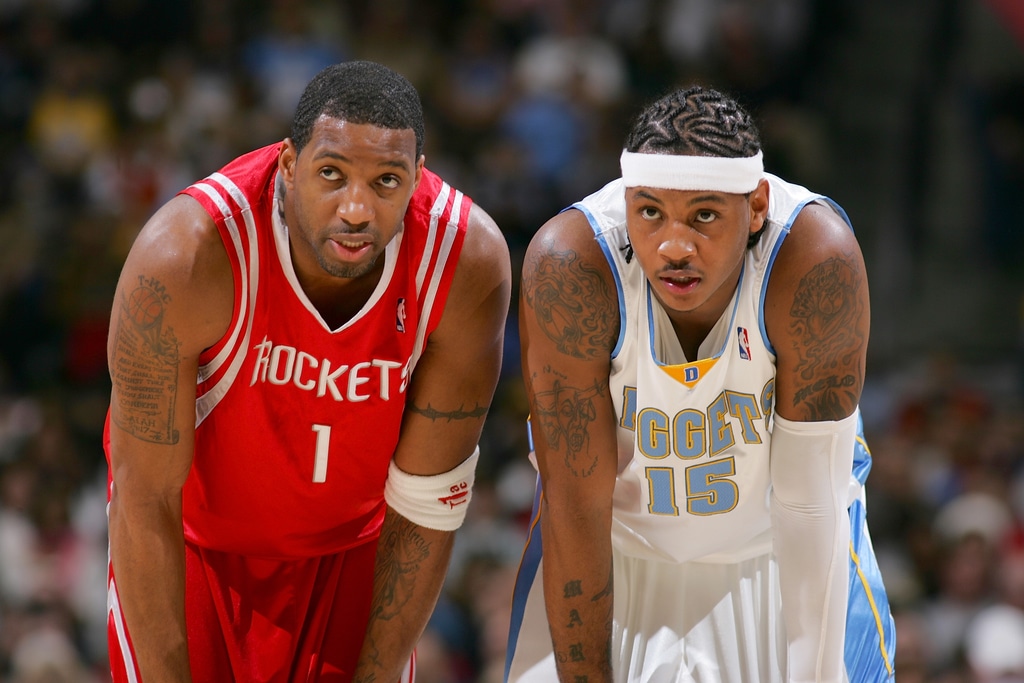 Houston Rockets guard Tracy McGrady, left, walks back to the bench News  Photo - Getty Images