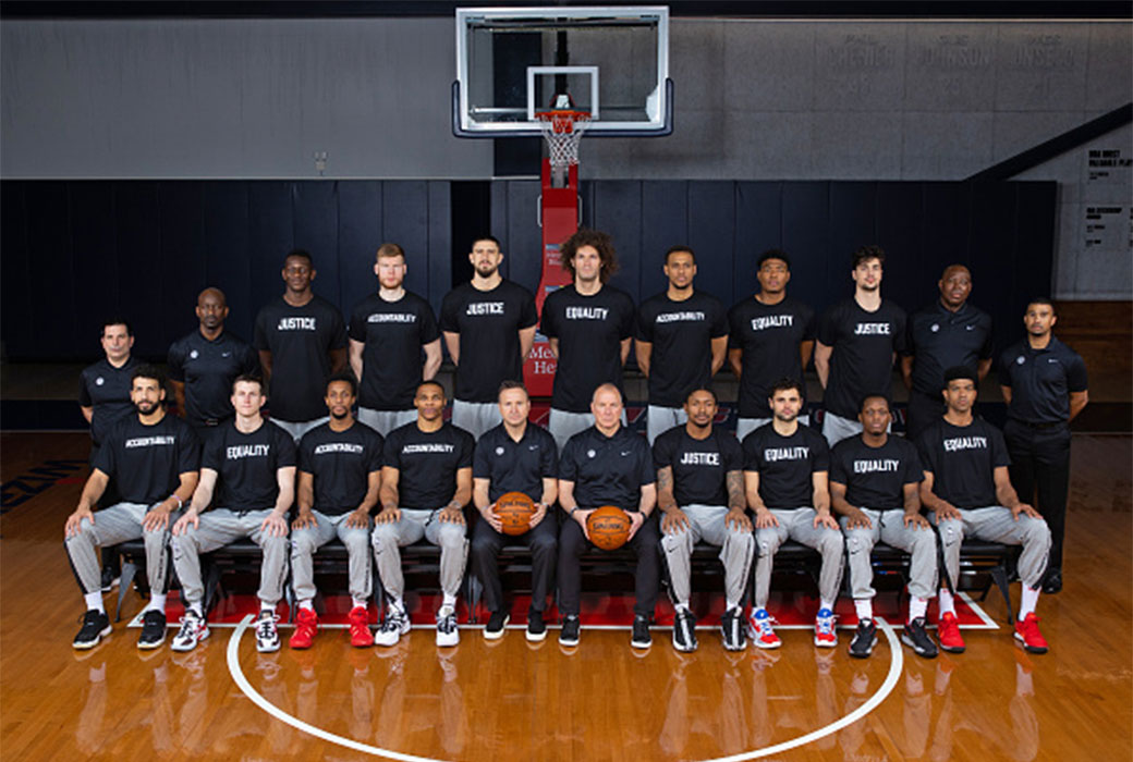 Wizards take team photo wearing shirts promoting 'equality,' 'justice,'  'accountability